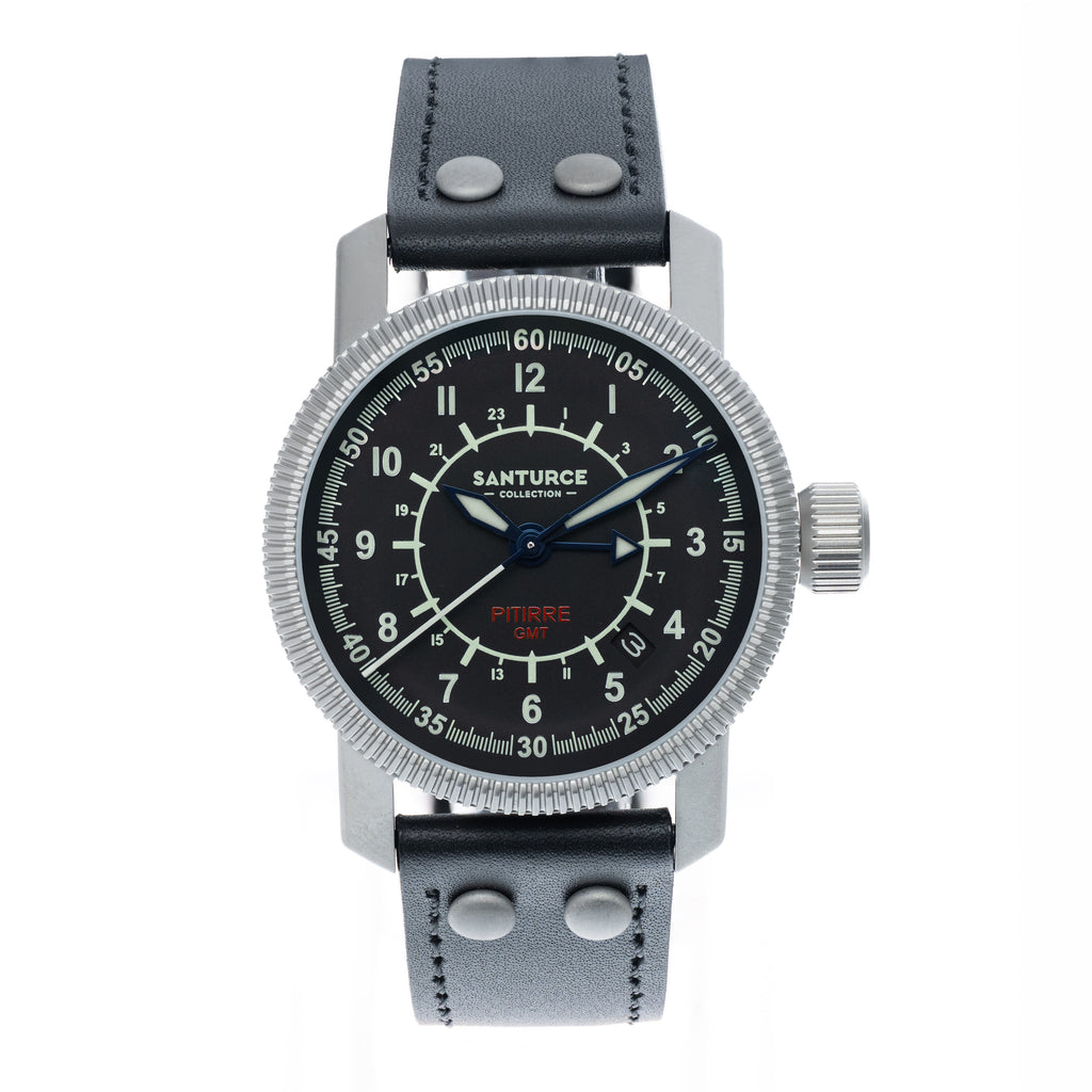 A Santurce Pitirre GMT  38mm pilot-style wristwatch with a black dial, silver-tone case, and black leather strap, shown against a plain white background.