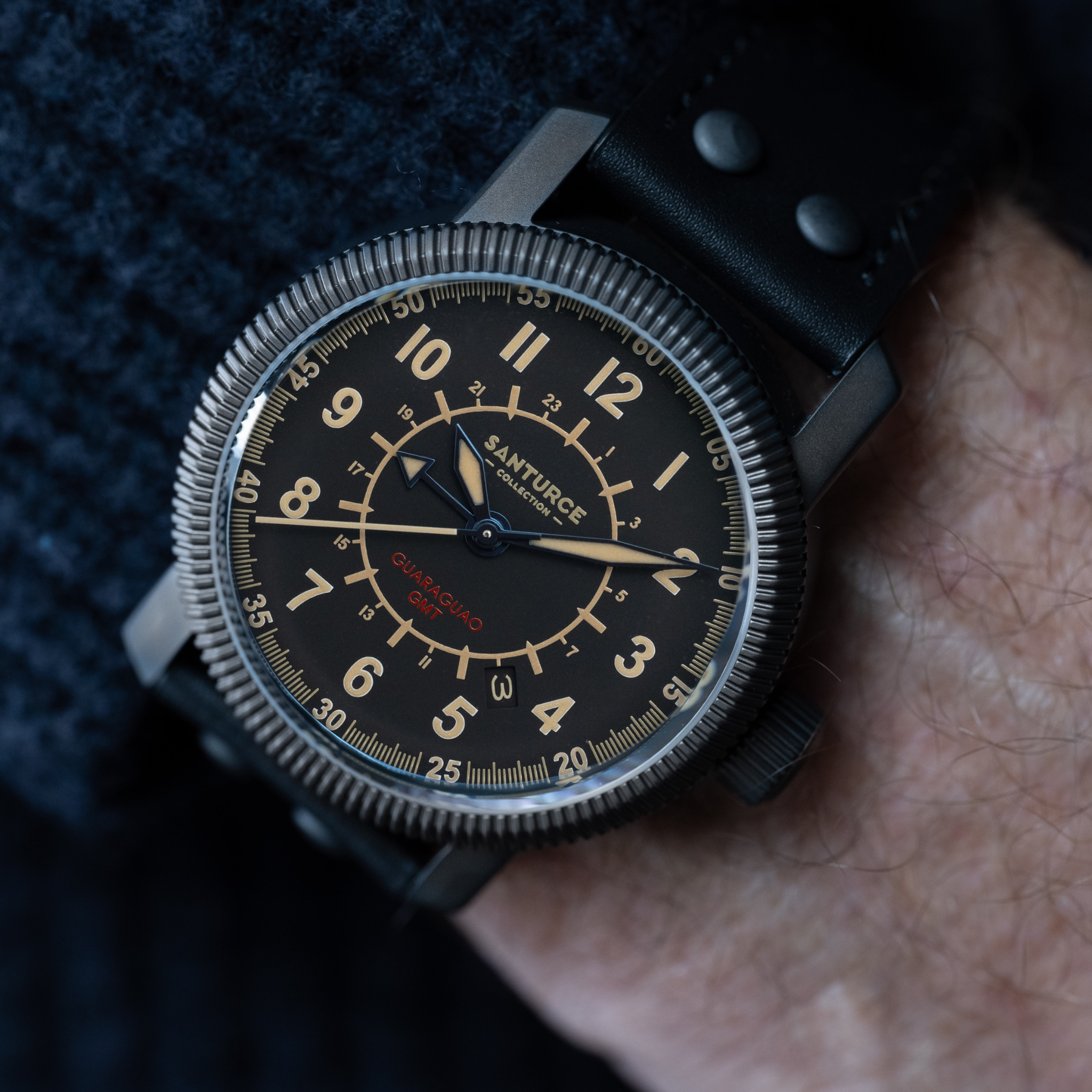 Guaraguao True GMT watch side view on black leather strap